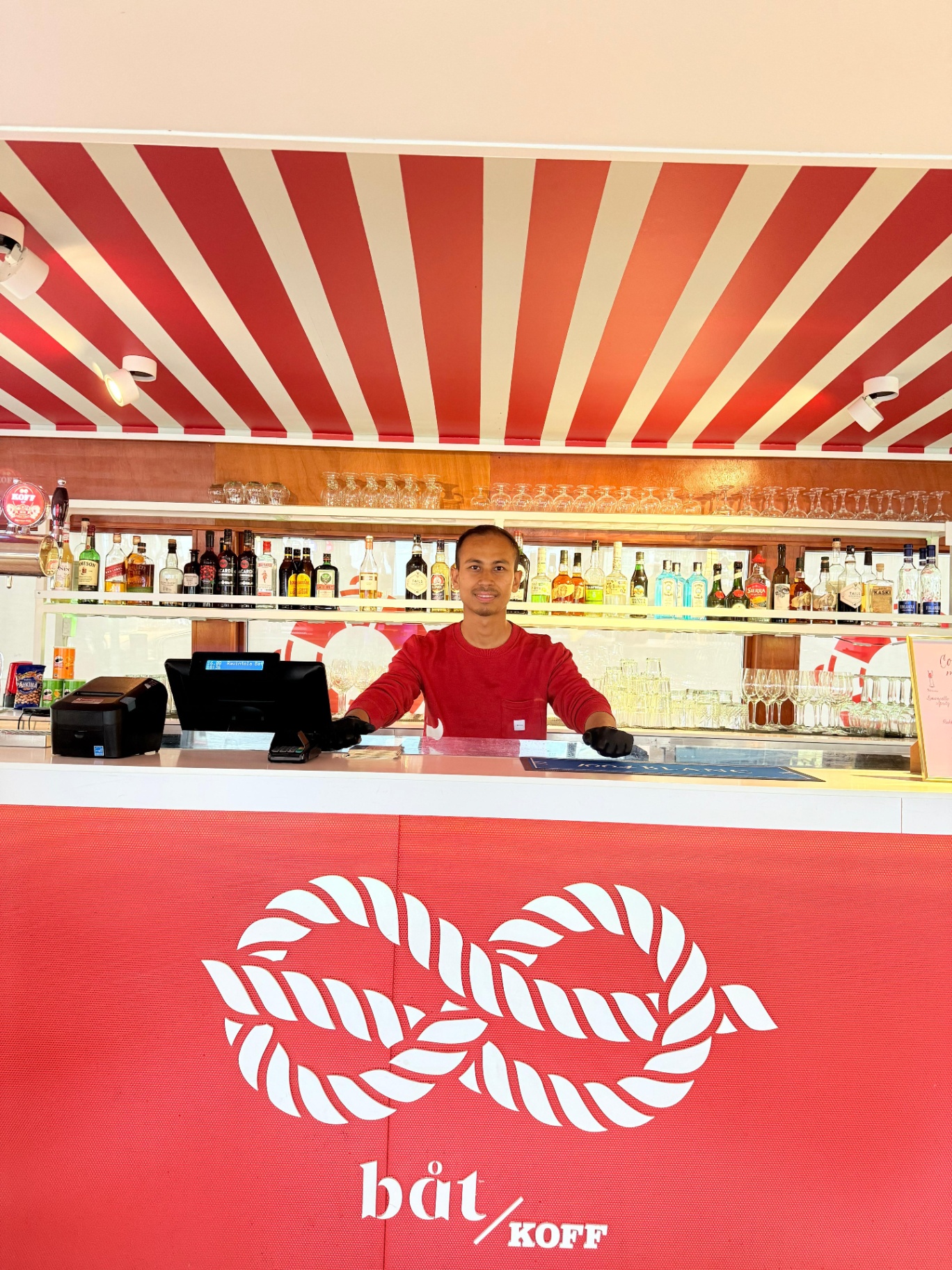 Ujjwal supporting service behind the bar